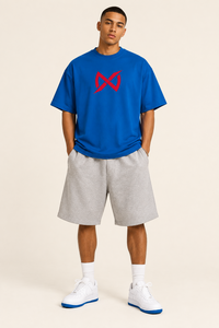 A royal blue short-sleeve crewneck t-shirt featuring a red stylized infinity symbol printed on the center chest, displayed against a solid white background.
